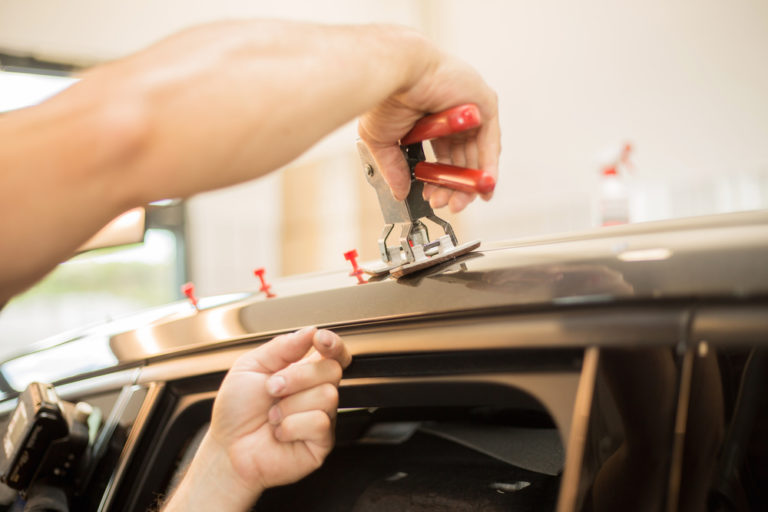What Is Paintless Dent Repair & Will It Work On My Car? | Elmer's Auto Body