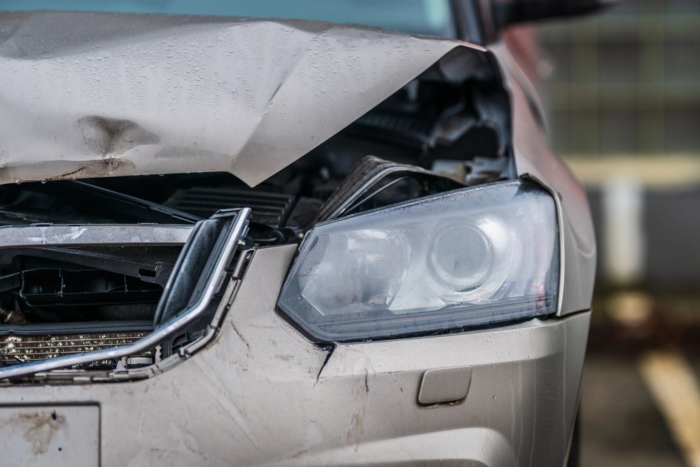 The bent hood of a car after a front-end collision