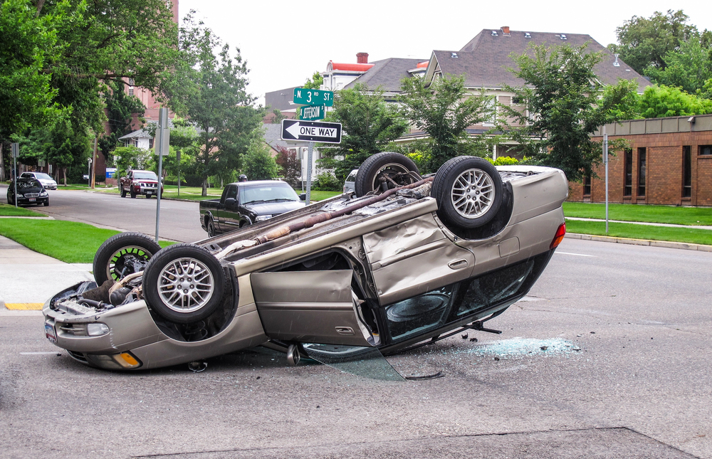 A flipped over car. The dent removal cost will be high.