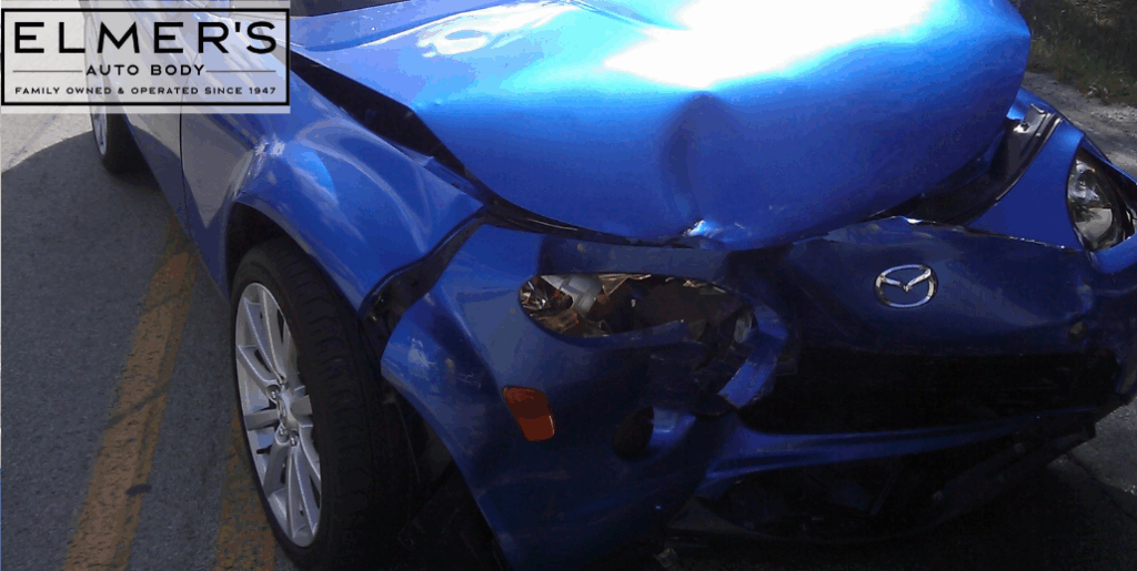 Insurance totaled this blue Mazda, but the owner disagrees.