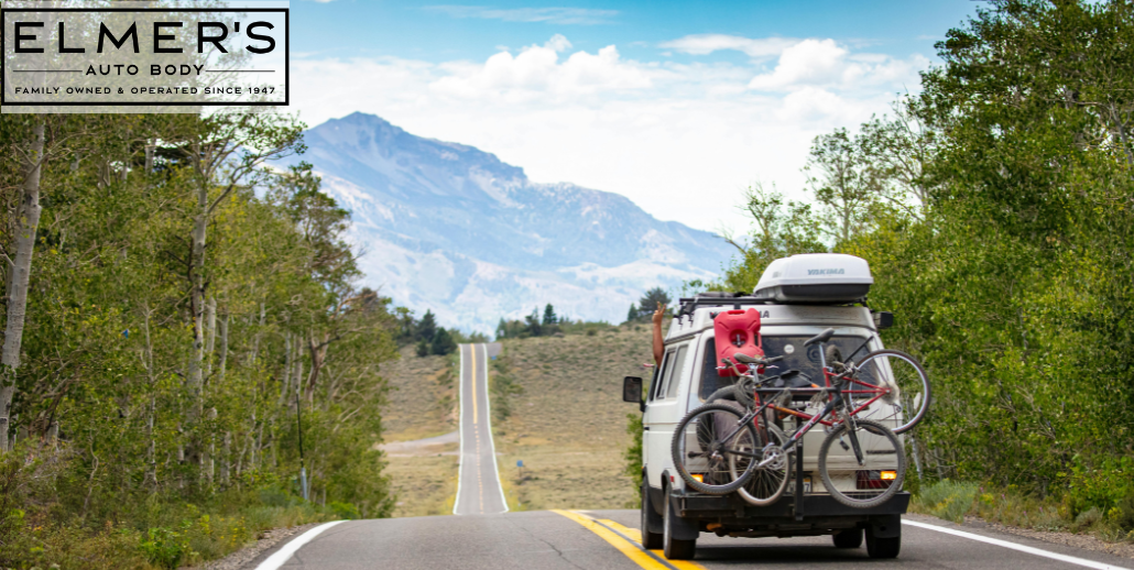 A van on a road trip, putting on summer mileage that will test if recent repairs were done correctly. Mountain in the background.